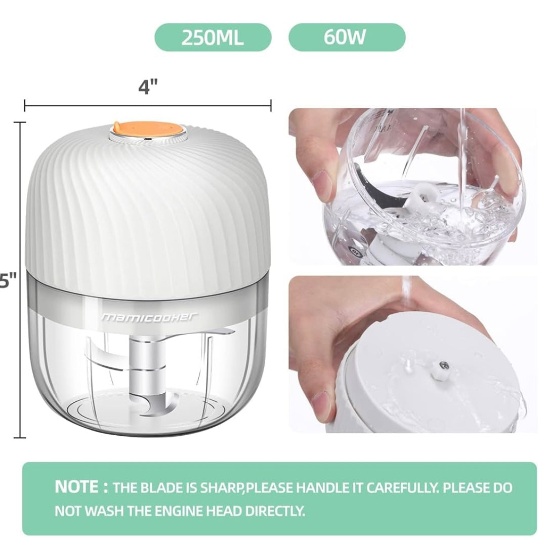 Bottom view of garlic chopper showing motor and detachable blades.