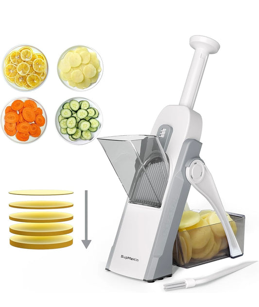 Adjustable vegetable slicer with safety handle and sliced cucumber, carrot, and potato chips.